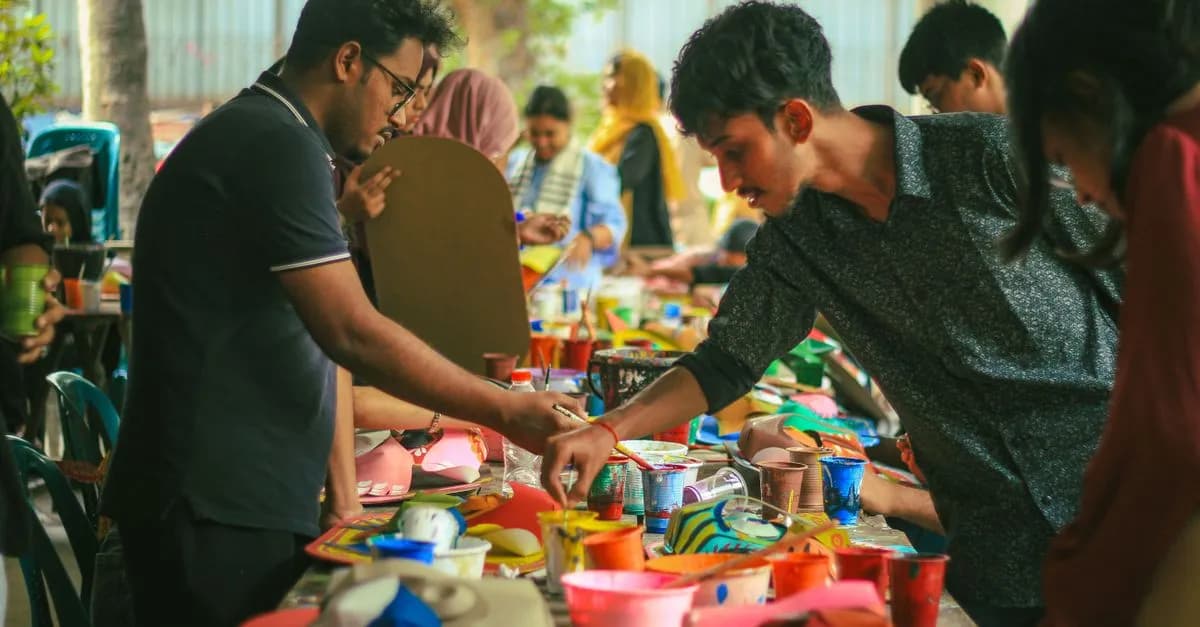 Students engaging in a vibrant art workshop at Dhaka University, showcasing creativity and collaboration.
